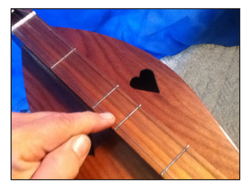 fretting using a finger